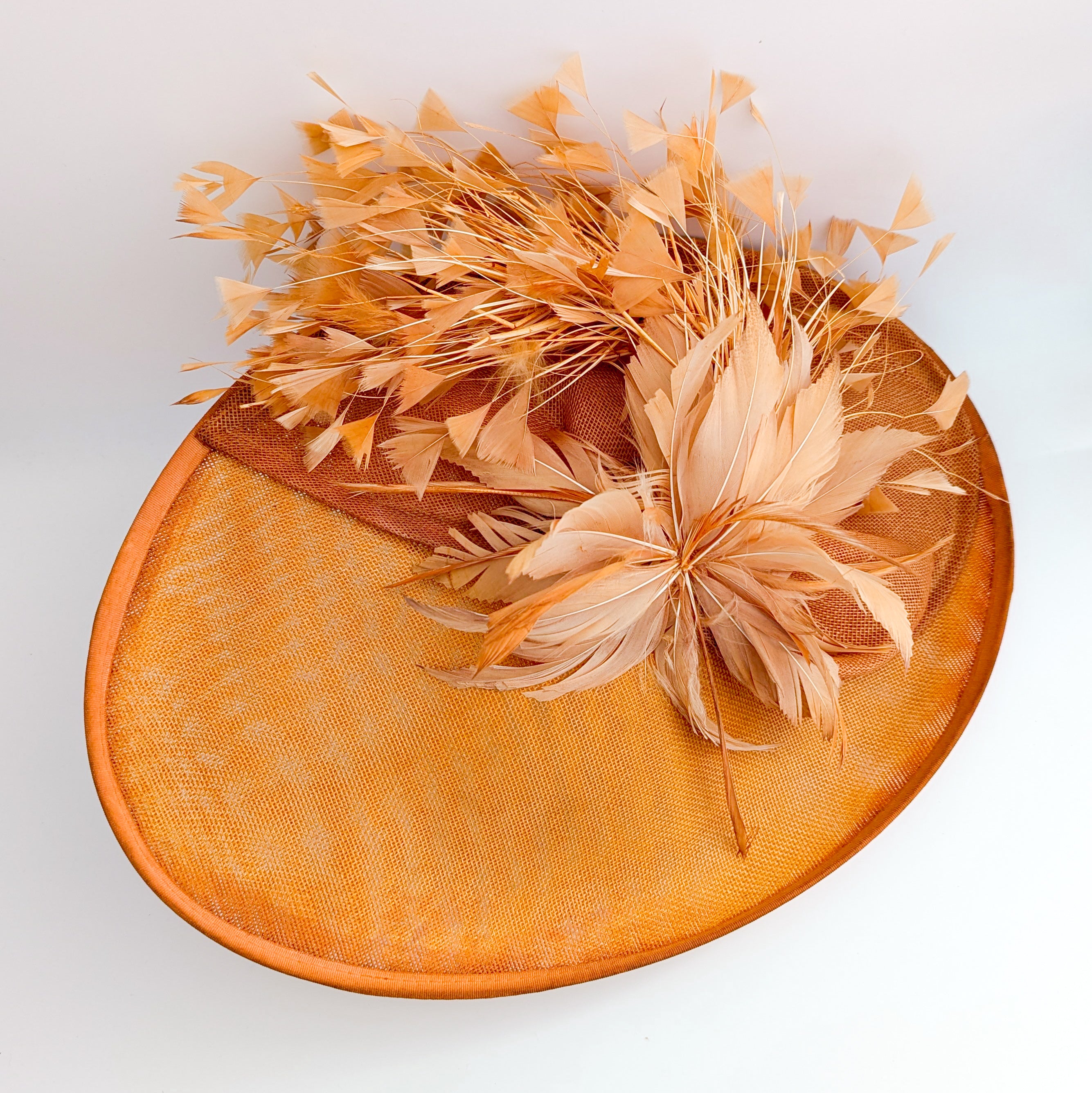 Terracotta dusty orange large feather oval disc fascinator hat