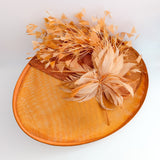 Terracotta dusty orange large feather oval disc fascinator hat