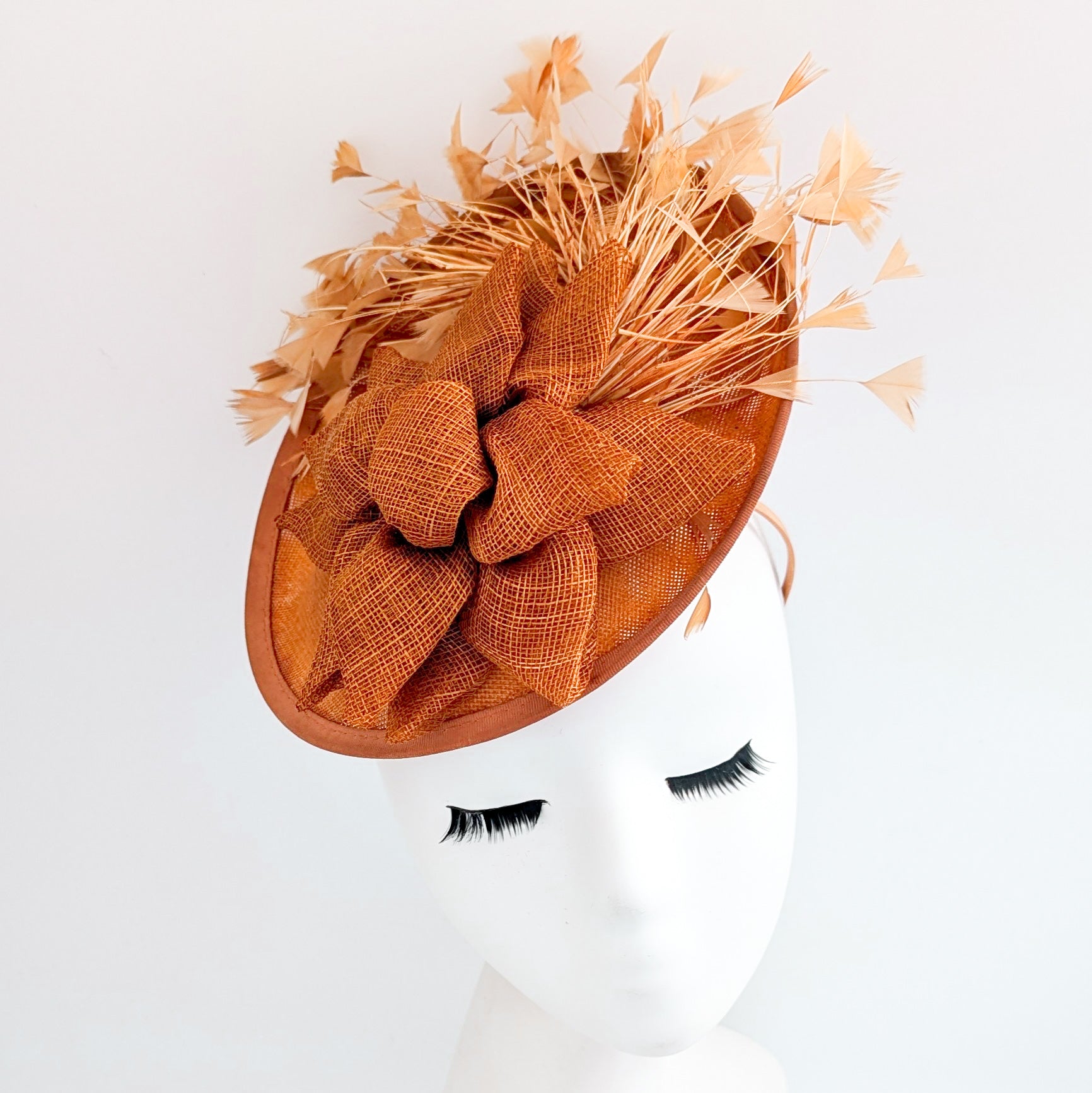 Burnt orange feather disc fascinator hat