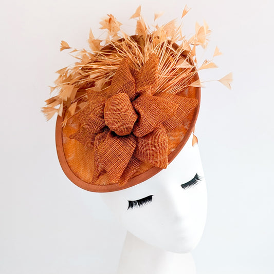 Burnt orange feather disc fascinator hat