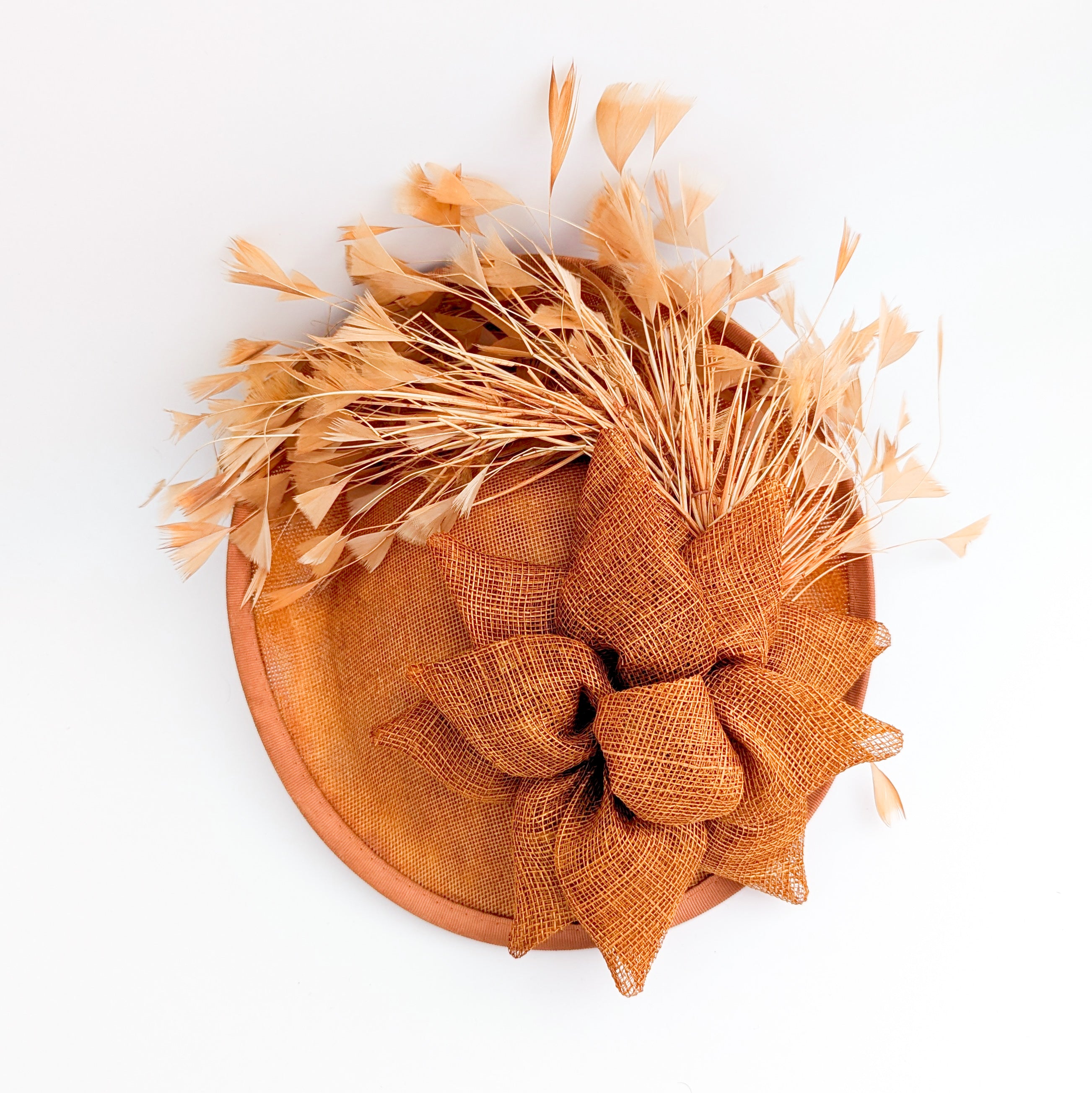 Burnt orange feather disc fascinator hat