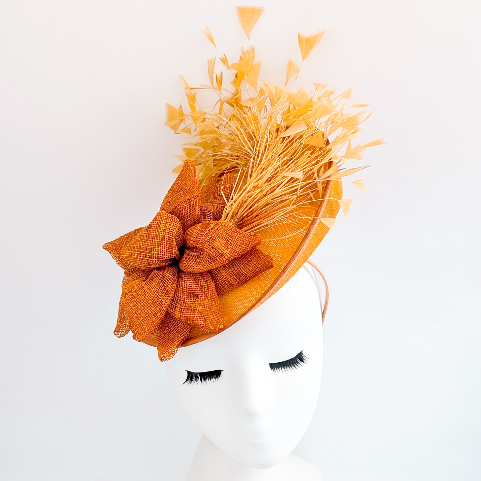 Tangerine orange feather disc fascinator hat
