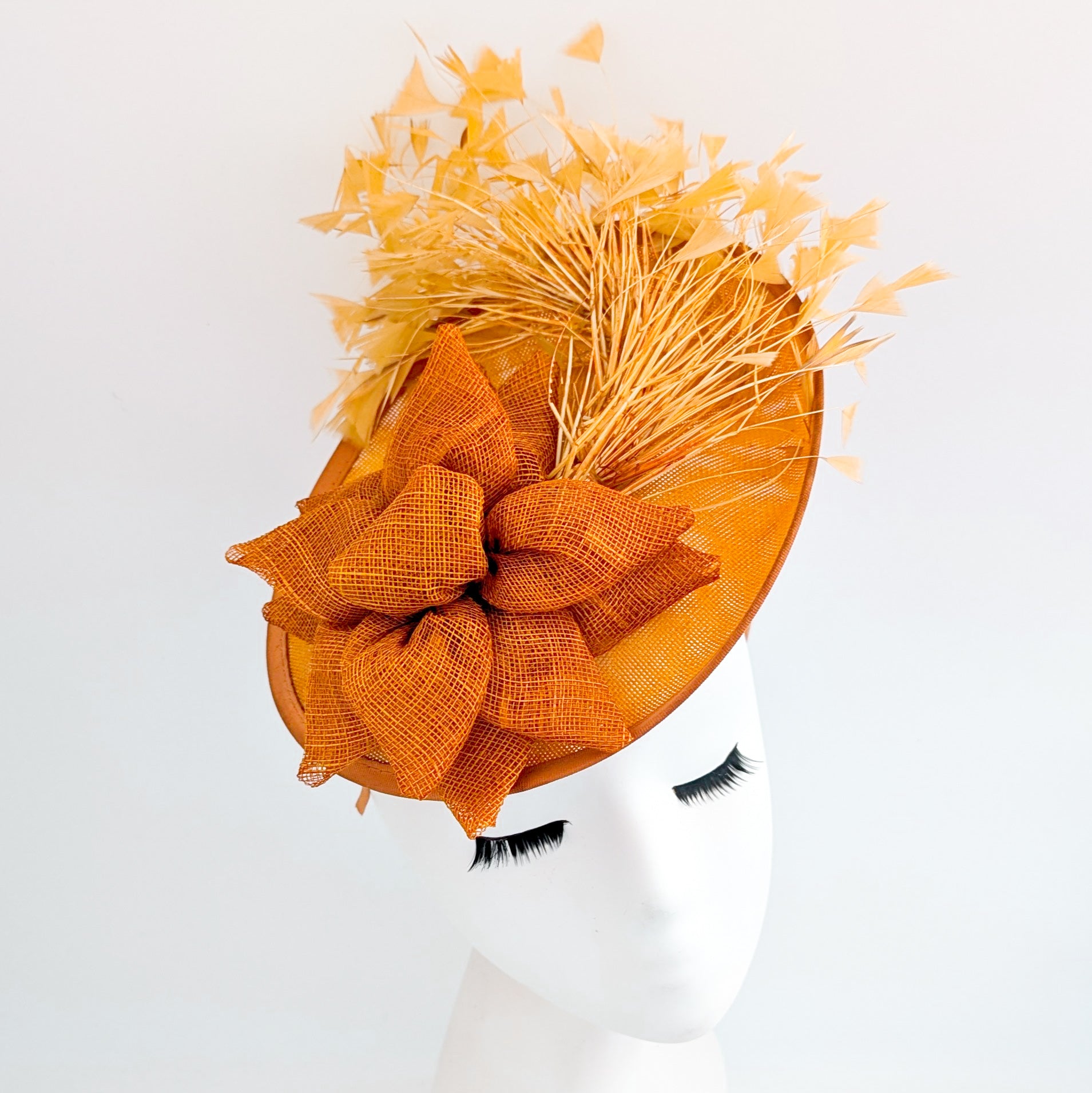 Tangerine orange feather disc fascinator hat