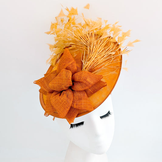 Tangerine orange feather disc fascinator hat