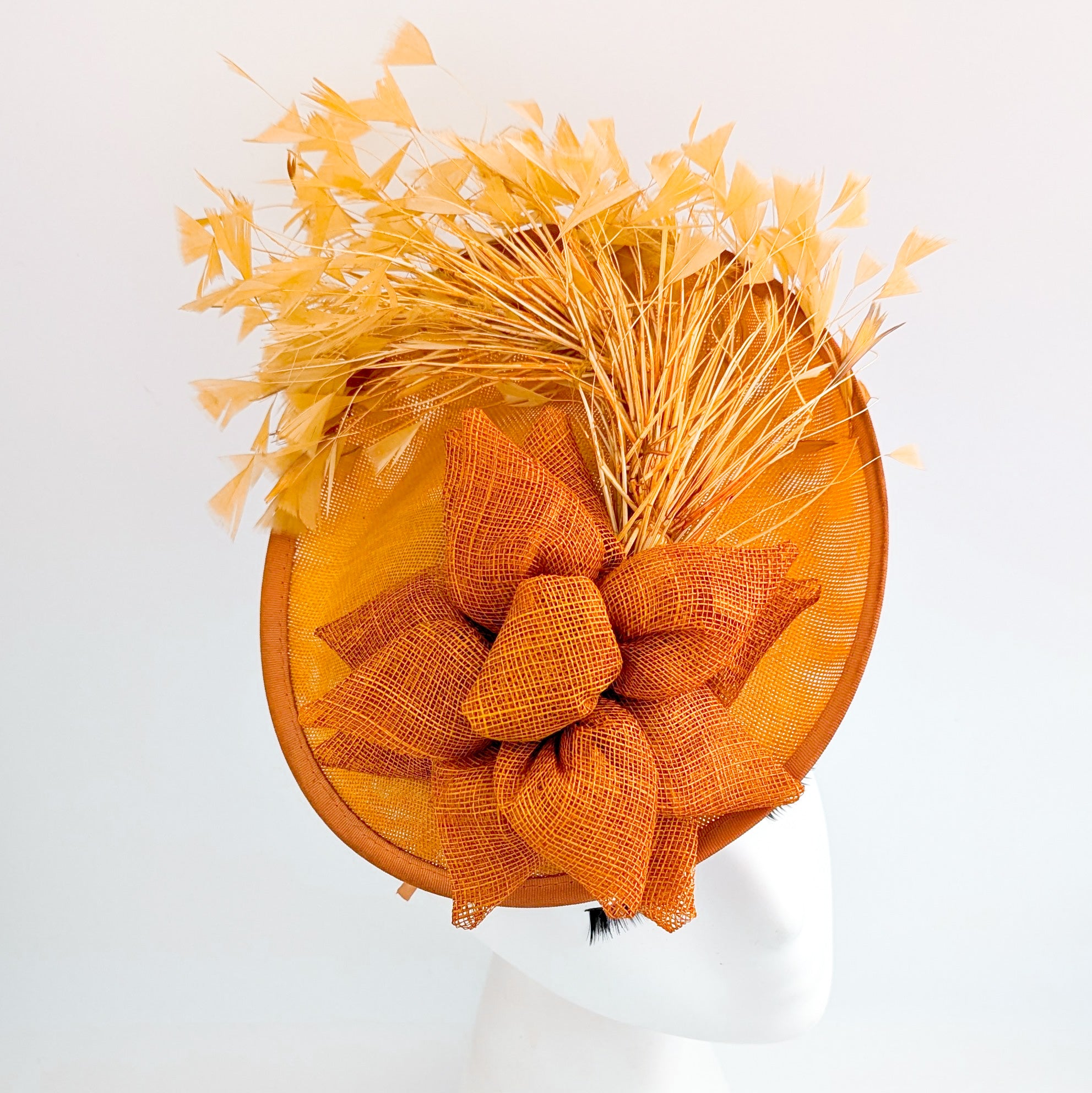 Tangerine orange feather disc fascinator hat