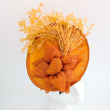 Tangerine orange feather disc fascinator hat
