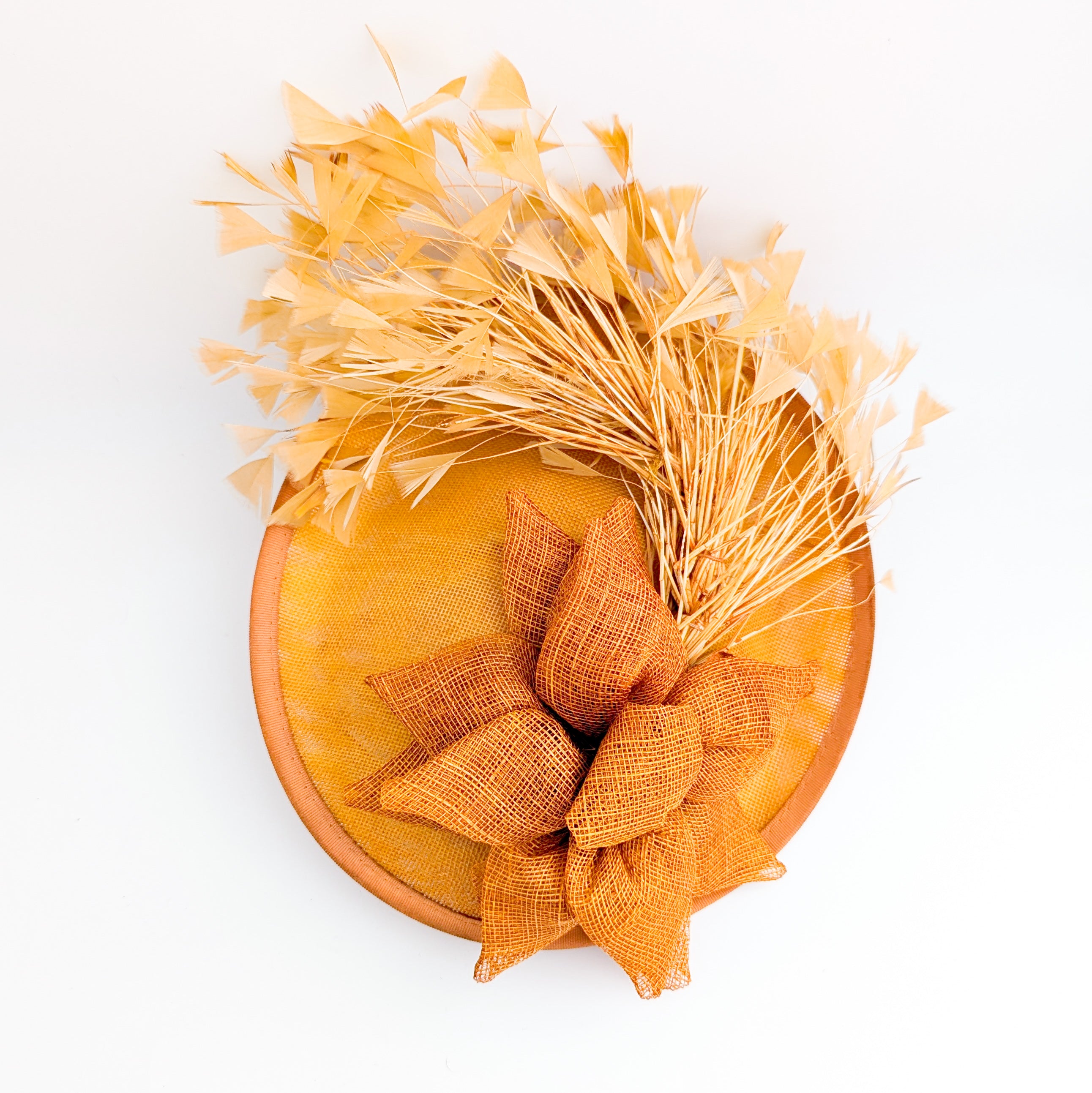 Tangerine orange feather disc fascinator hat