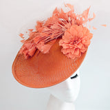Terracotta dusty coral large flower feather disc fascinator hat