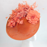 Terracotta dusty coral large flower feather disc fascinator hat