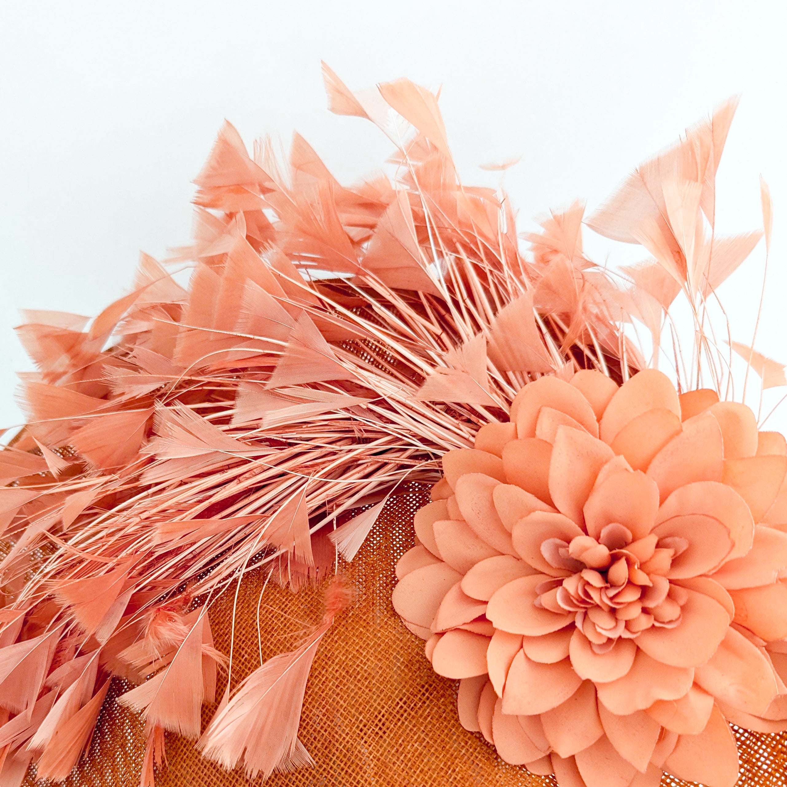 Terracotta dusty coral large flower feather disc fascinator hat