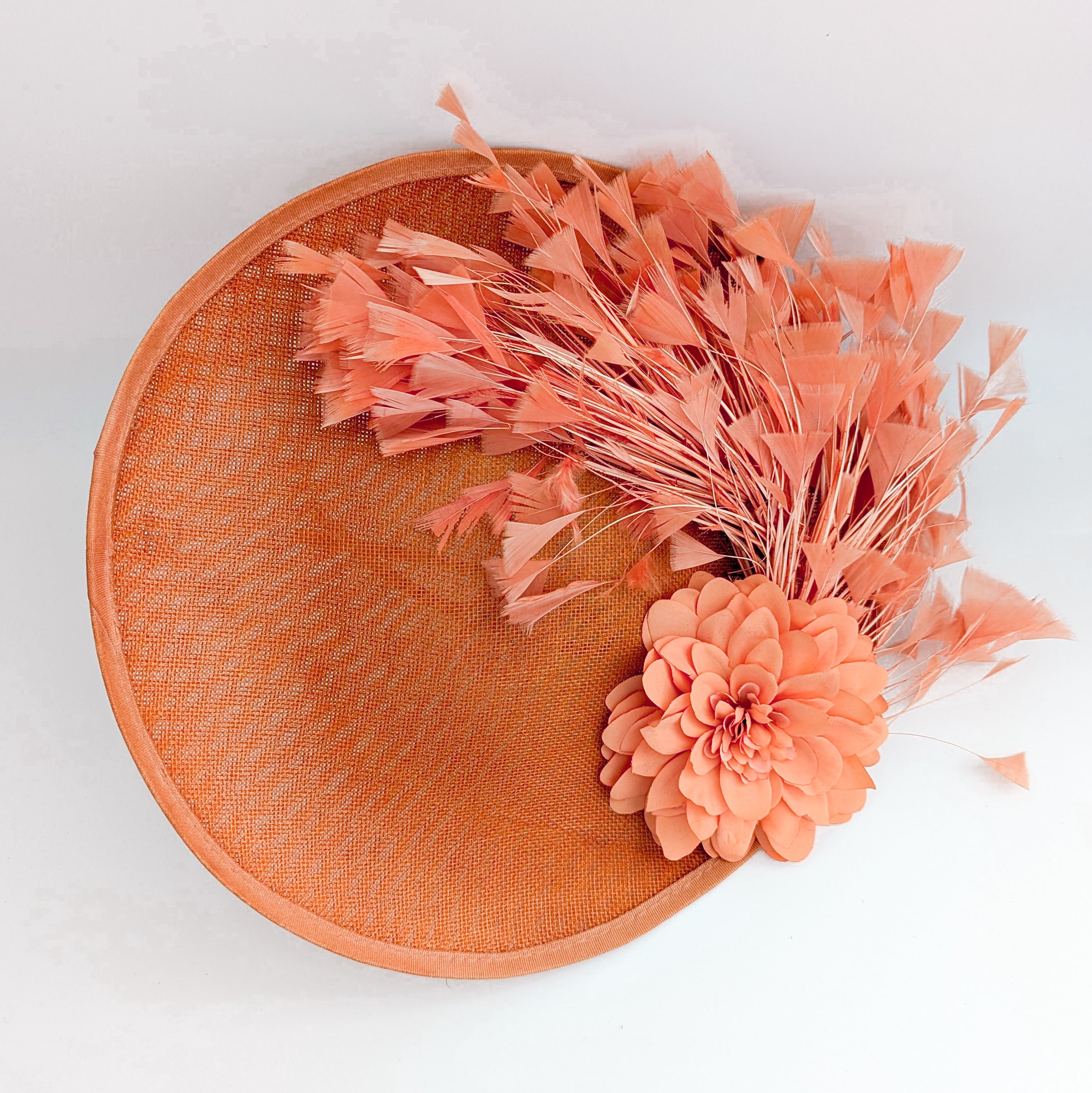 Terracotta dusty coral large flower feather disc fascinator hat