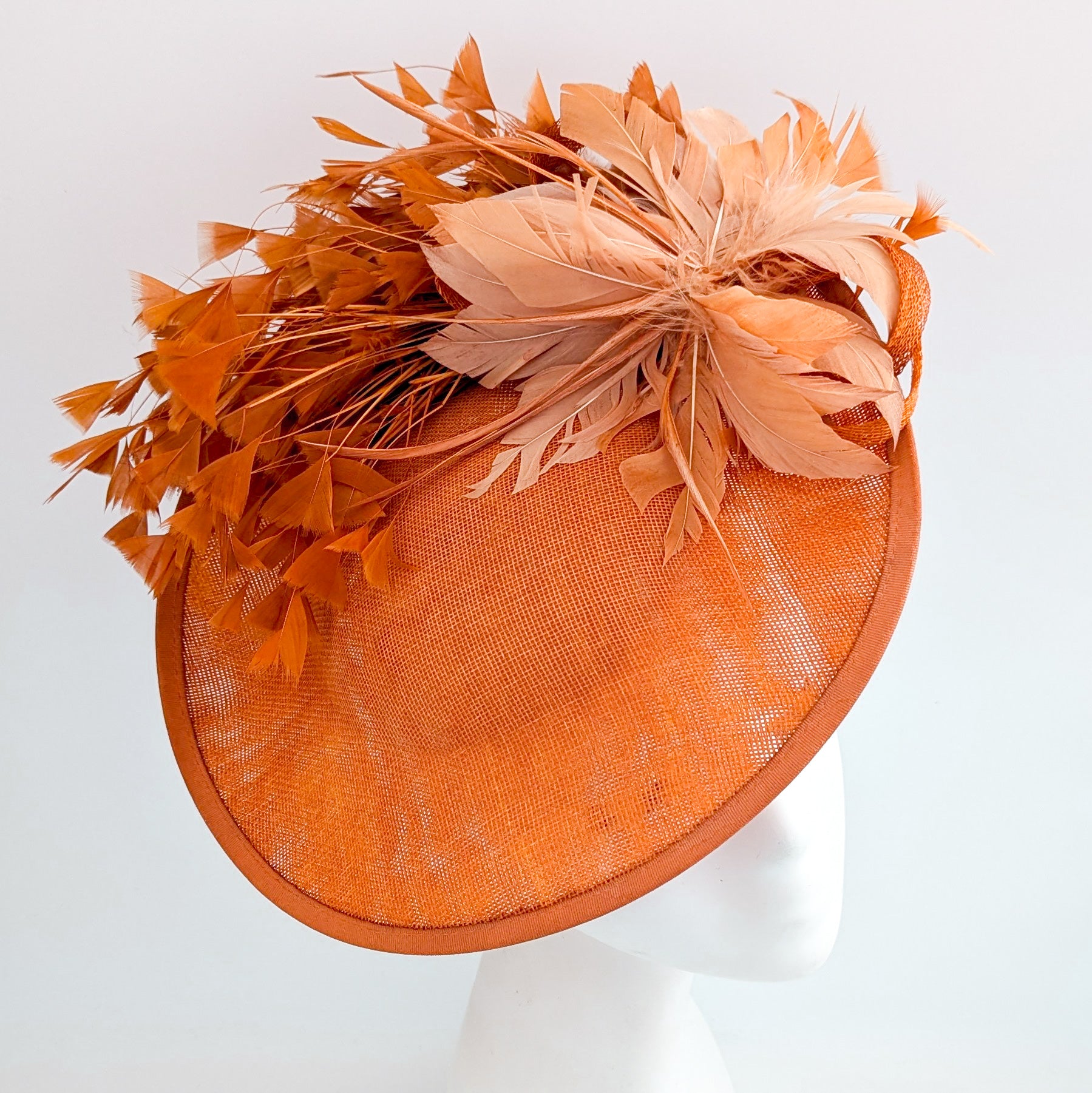 Terracotta dusty orange large feather disc fascinator hat