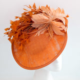 Terracotta dusty orange large feather disc fascinator hat
