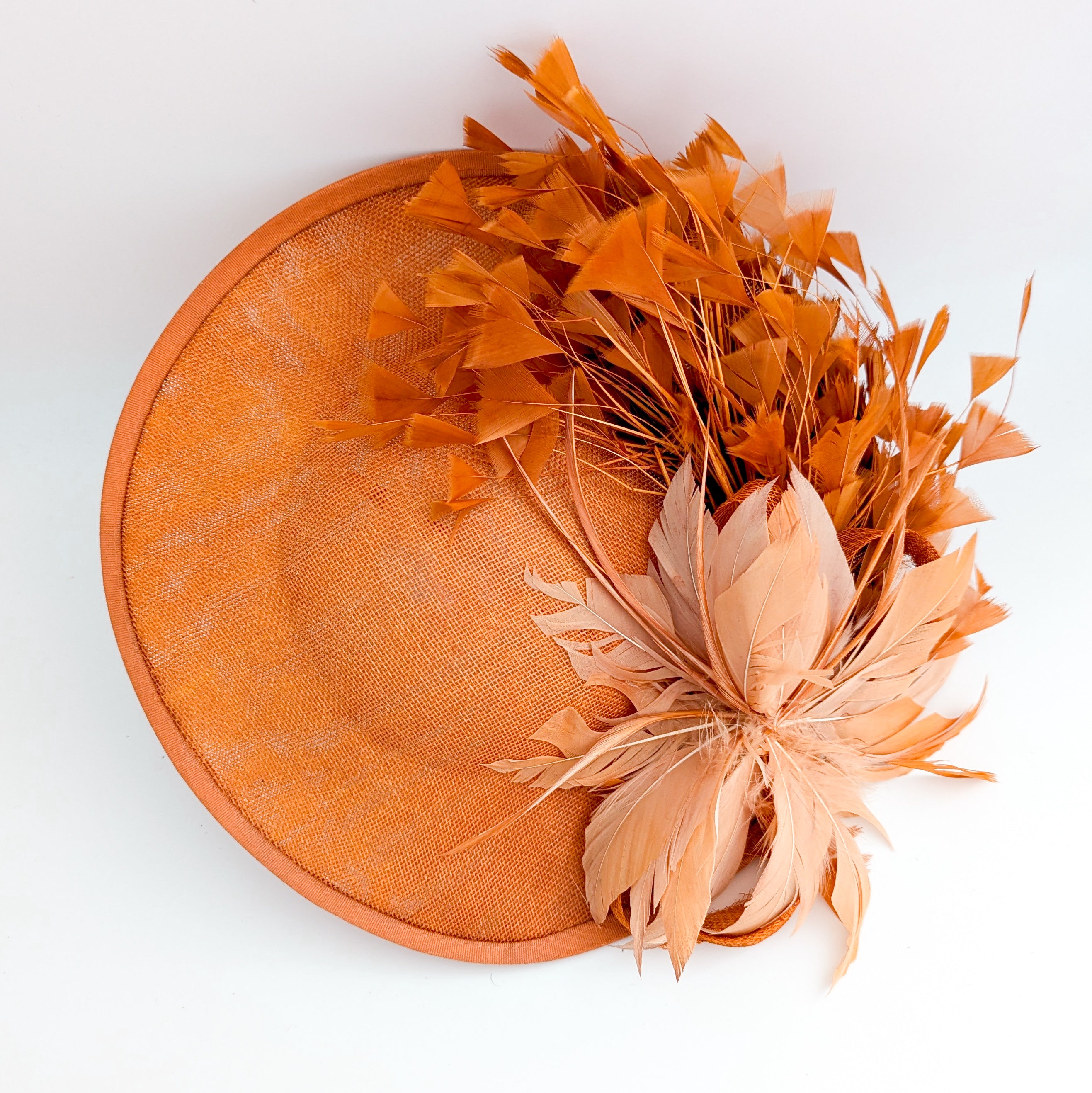 Terracotta dusty orange large feather disc fascinator hat