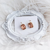 Light peach crystal gold emerald cut drop earrings