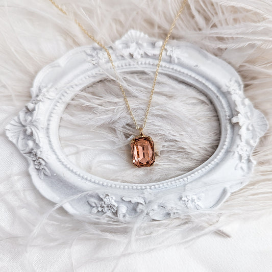 Light peach crystal gold emerald cut necklace