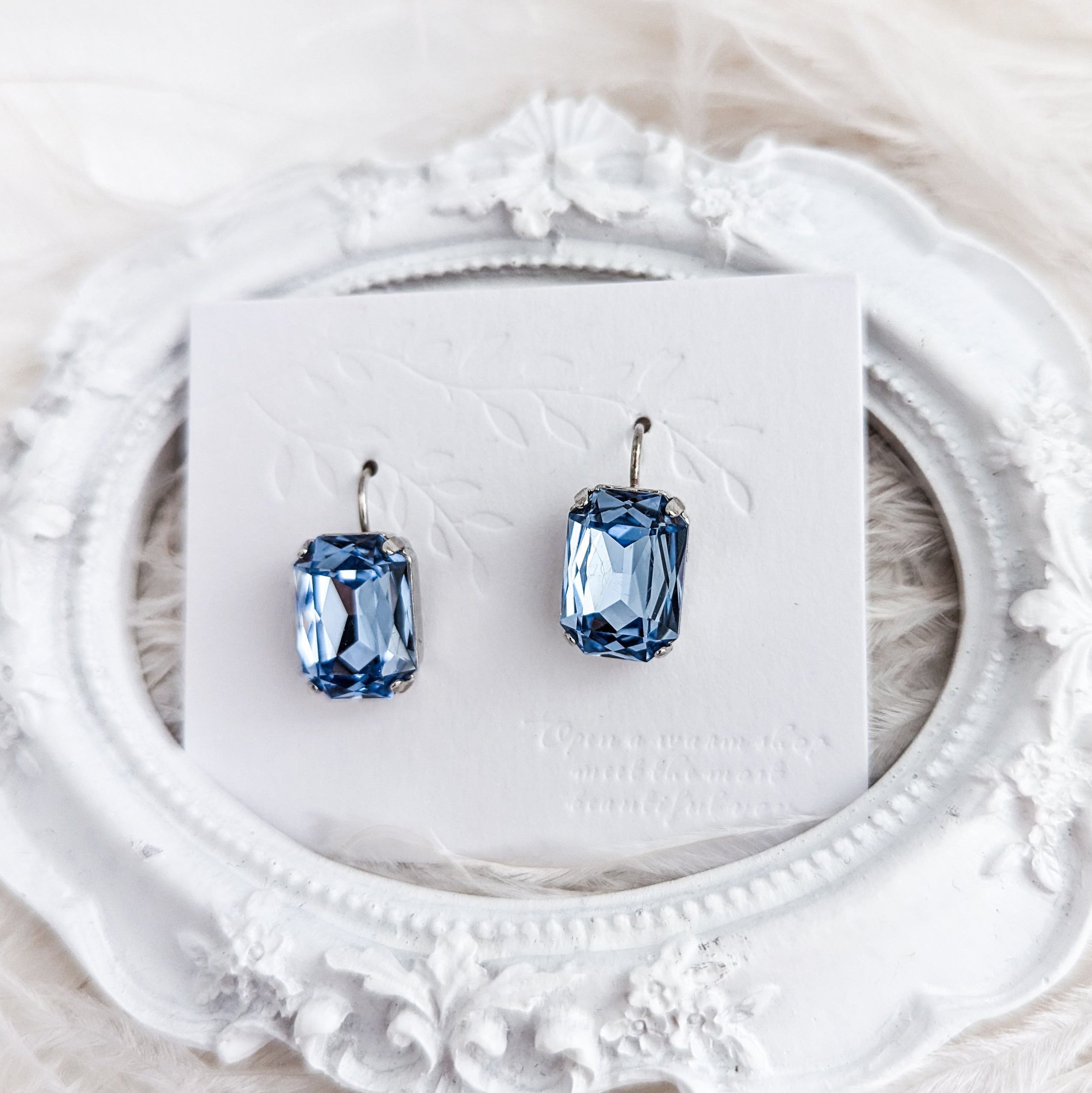 Light dusty blue crystal silver emerald cut drop earrings