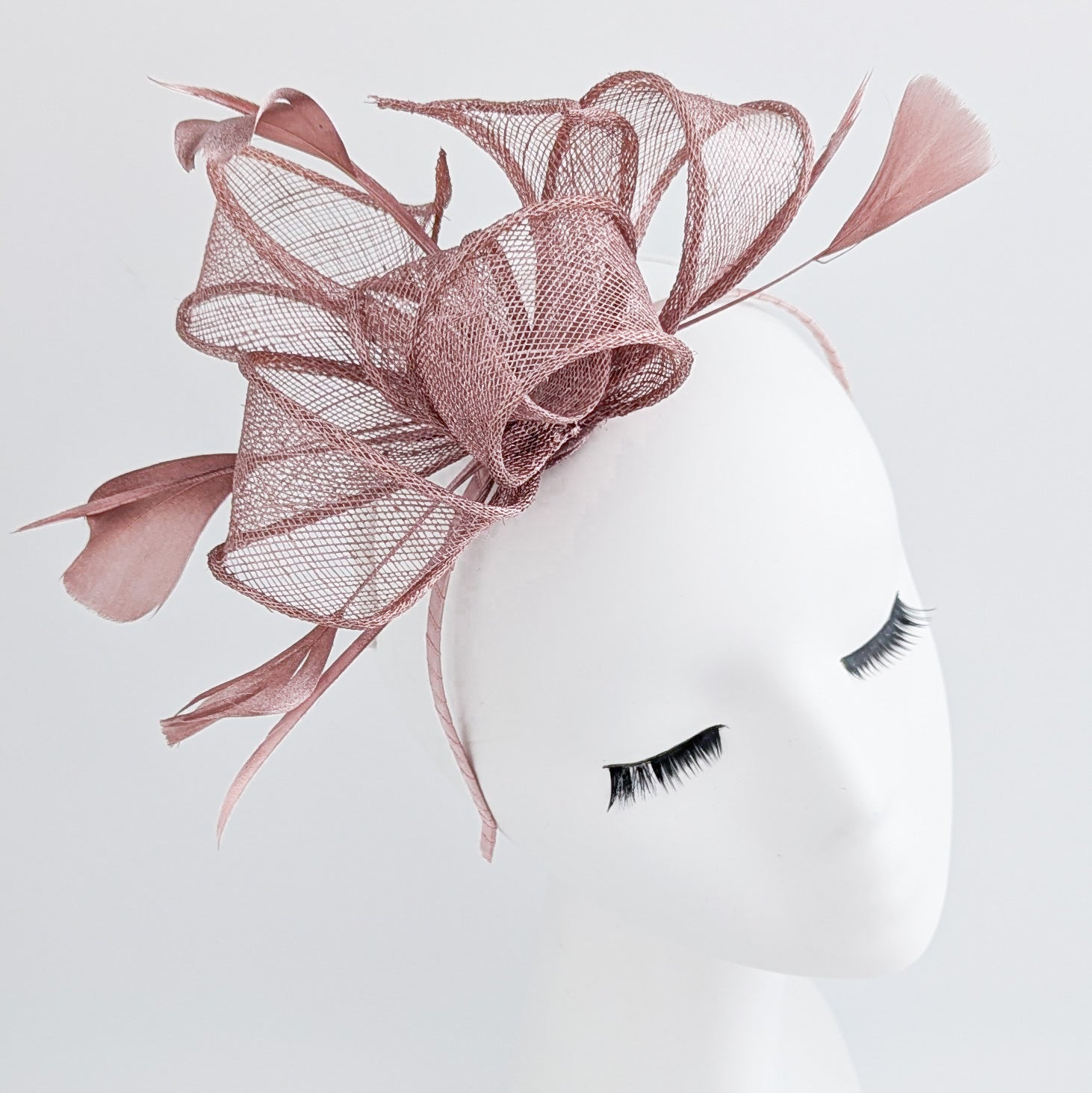 Rose gold shimmer feather fascinator hat