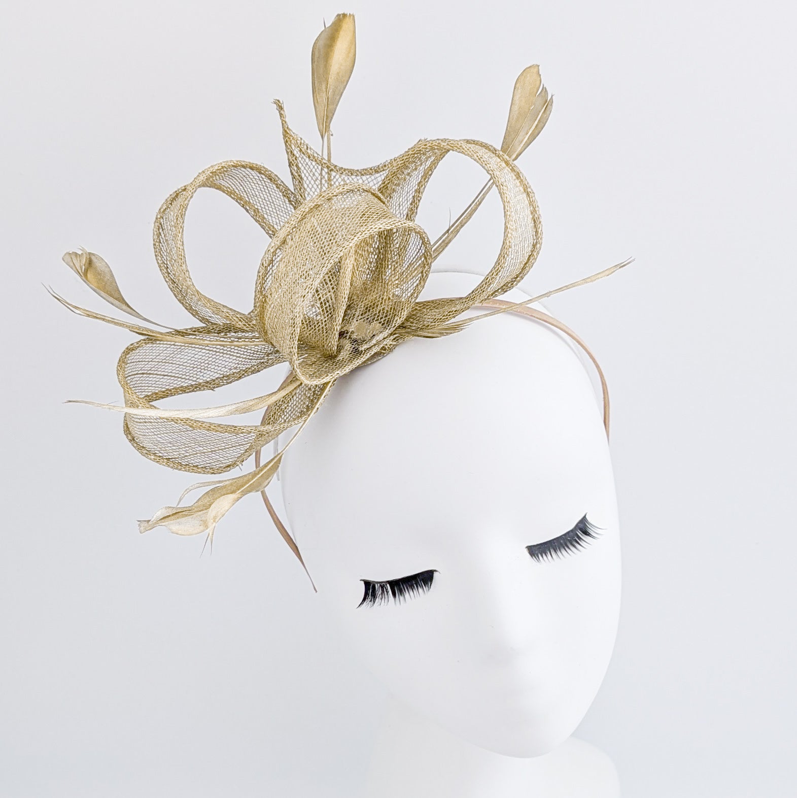 Gold shimmer feather fascinator hat House of Hats