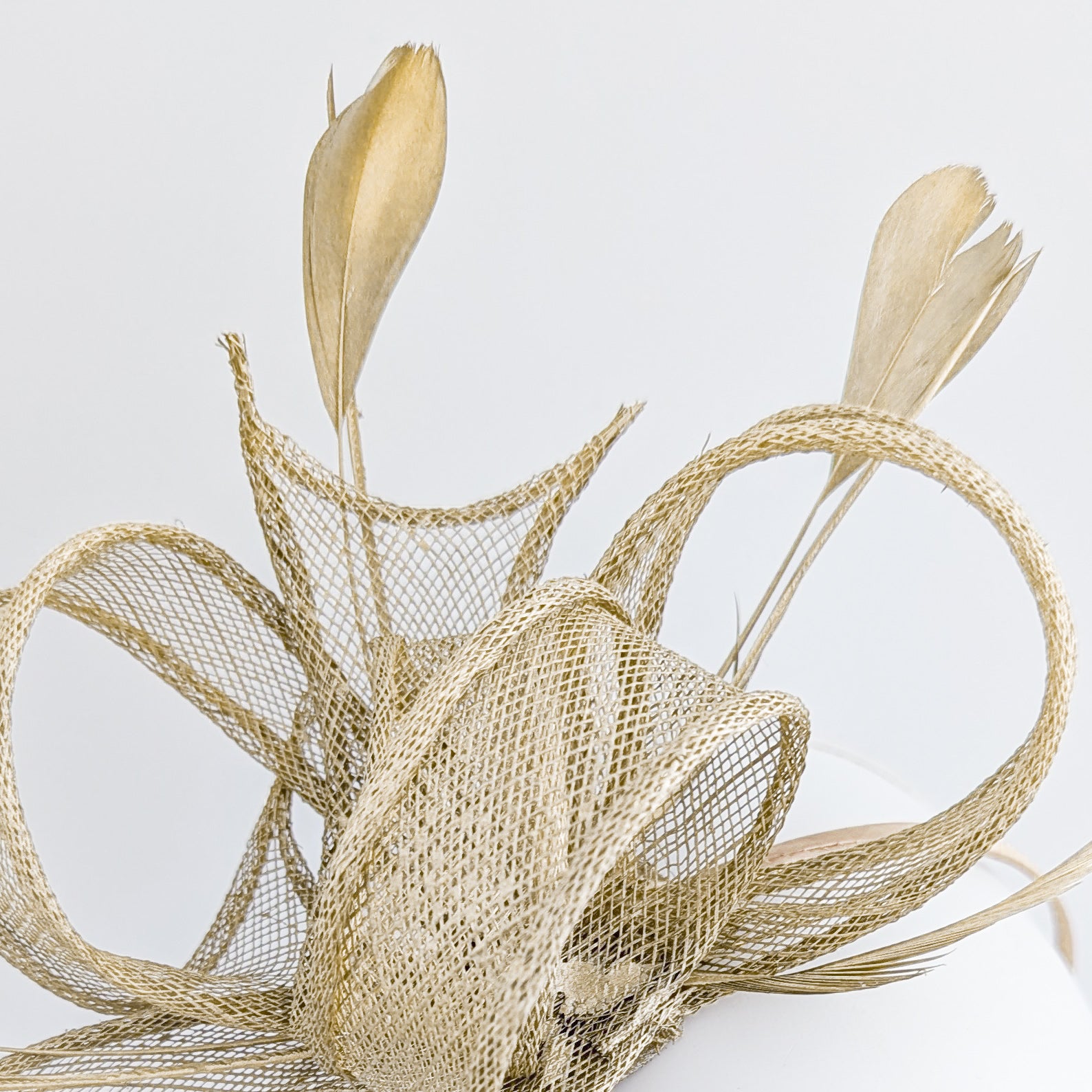 Gold shimmer feather fascinator hat House of Hats