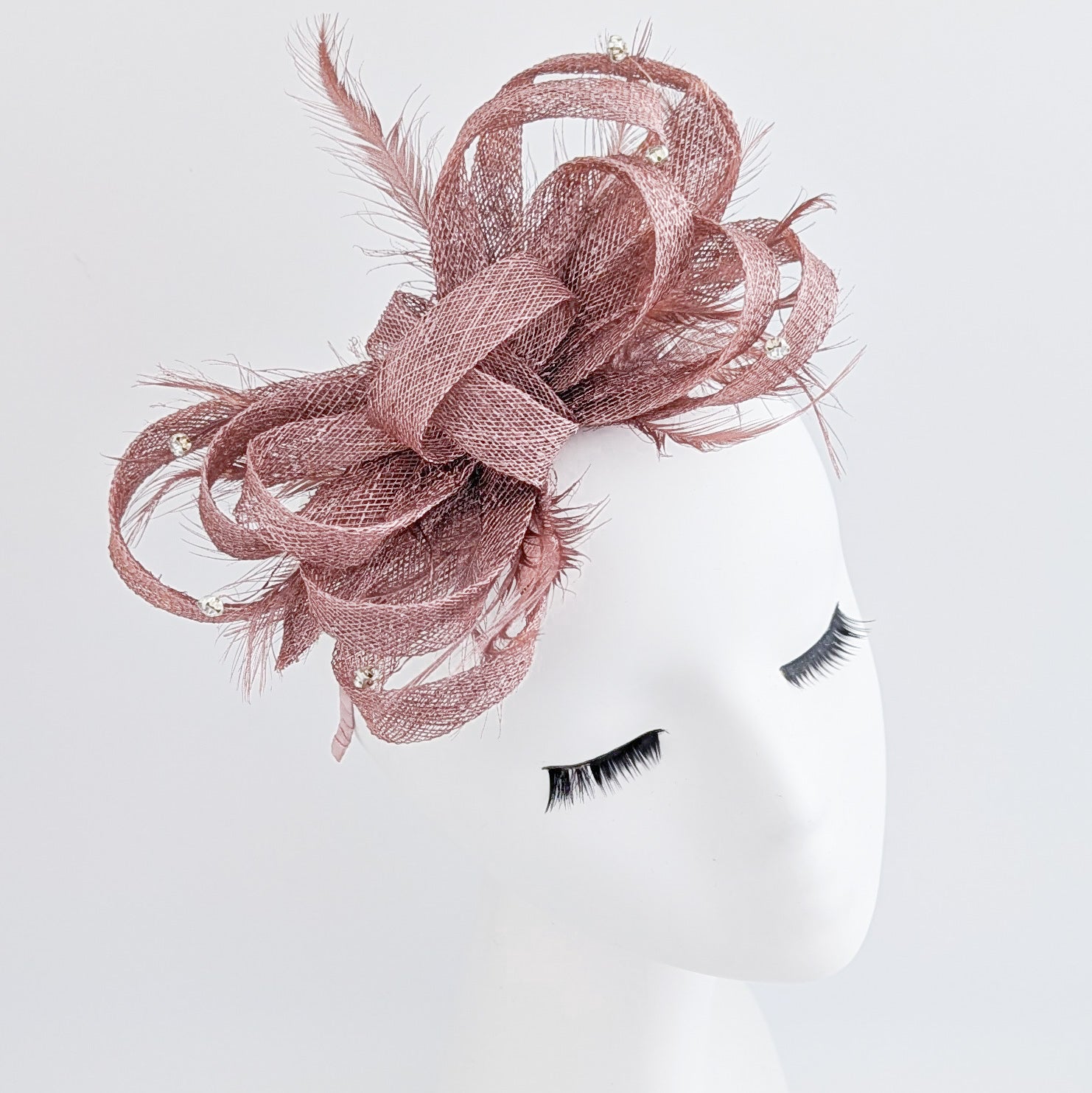 Rose gold shimmer crystal feather fascinator hat
