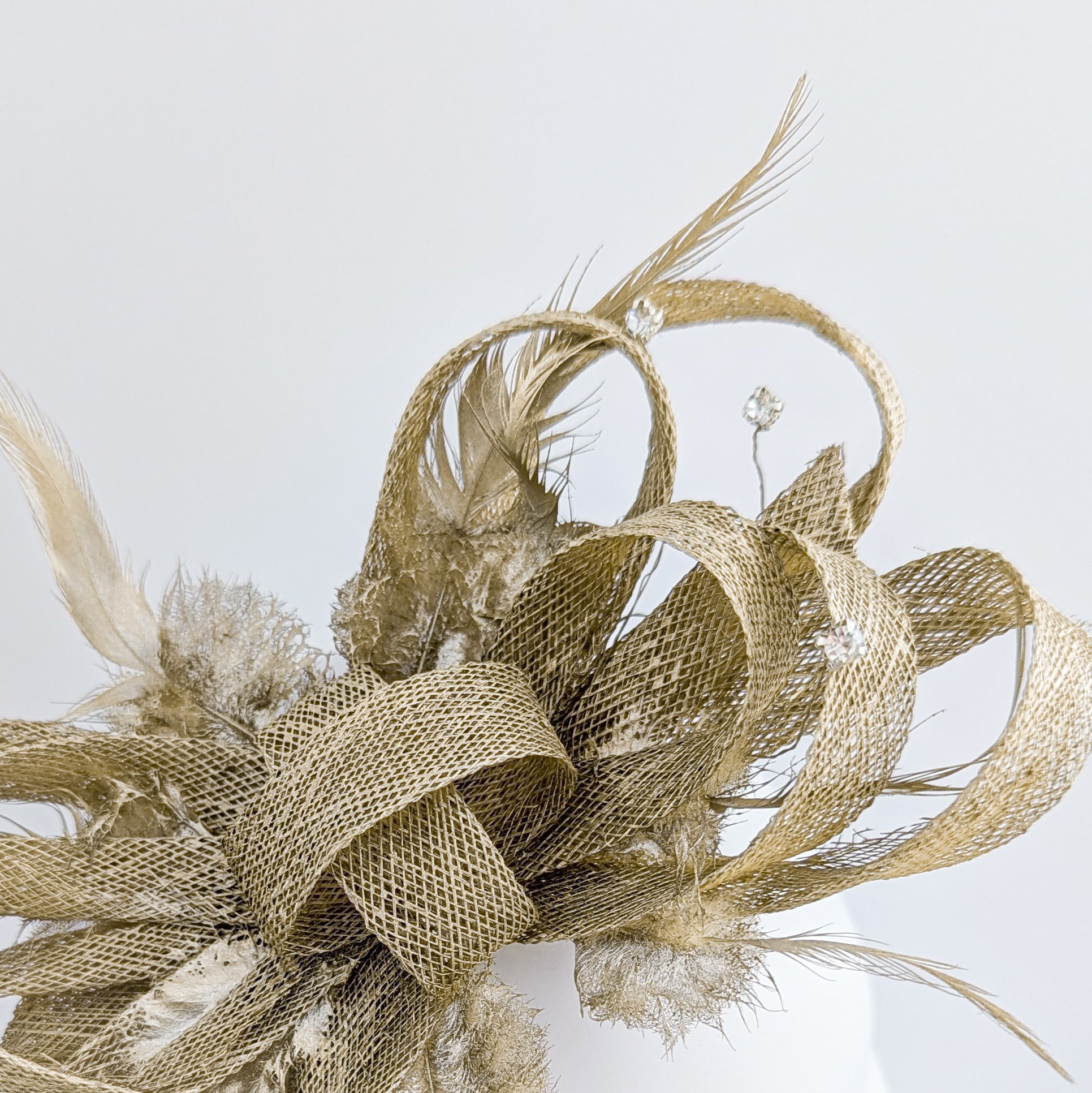 Gold shimmer crystal feather fascinator hat