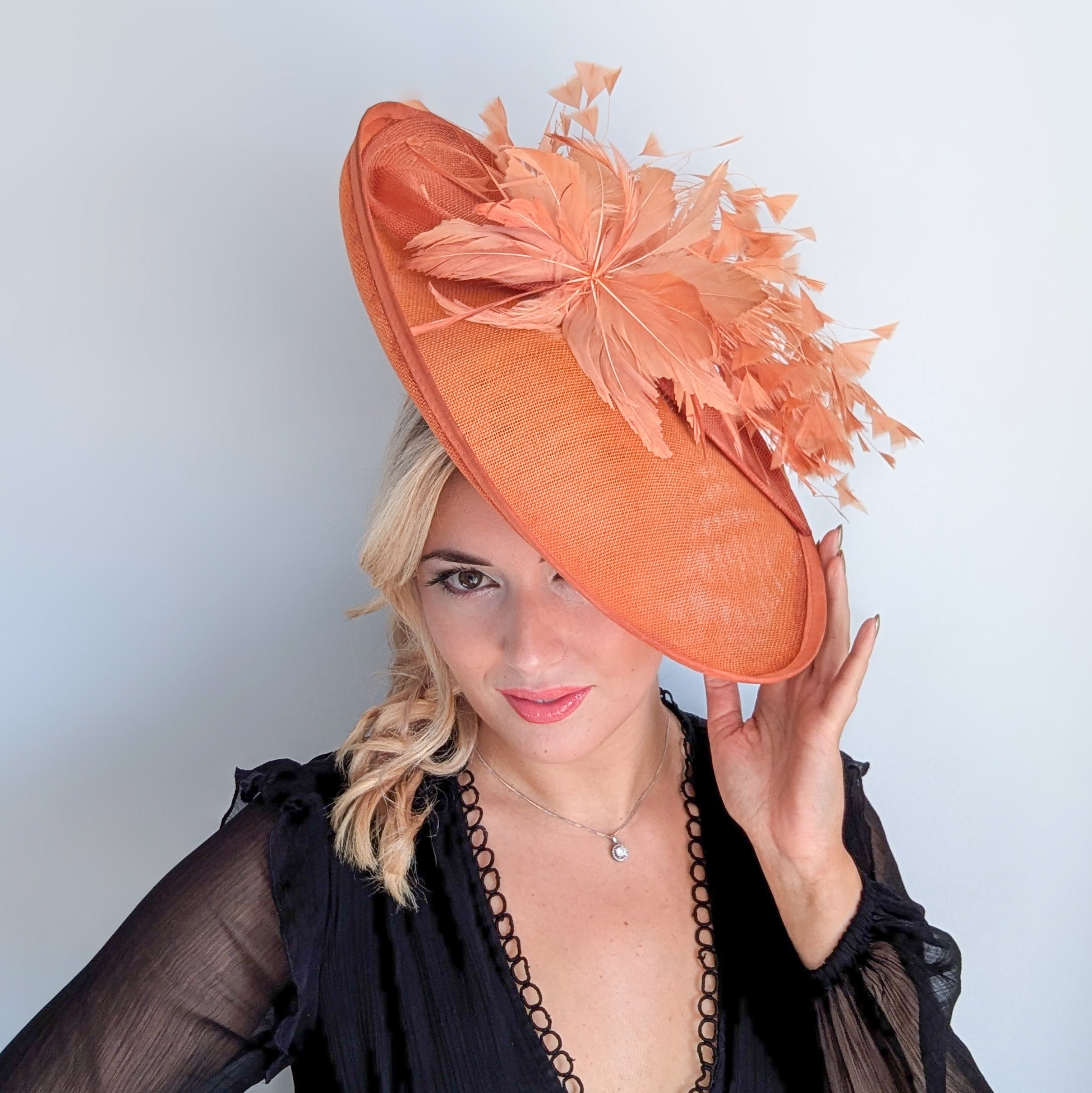 Terracotta dusty orange large feather oval disc fascinator hat