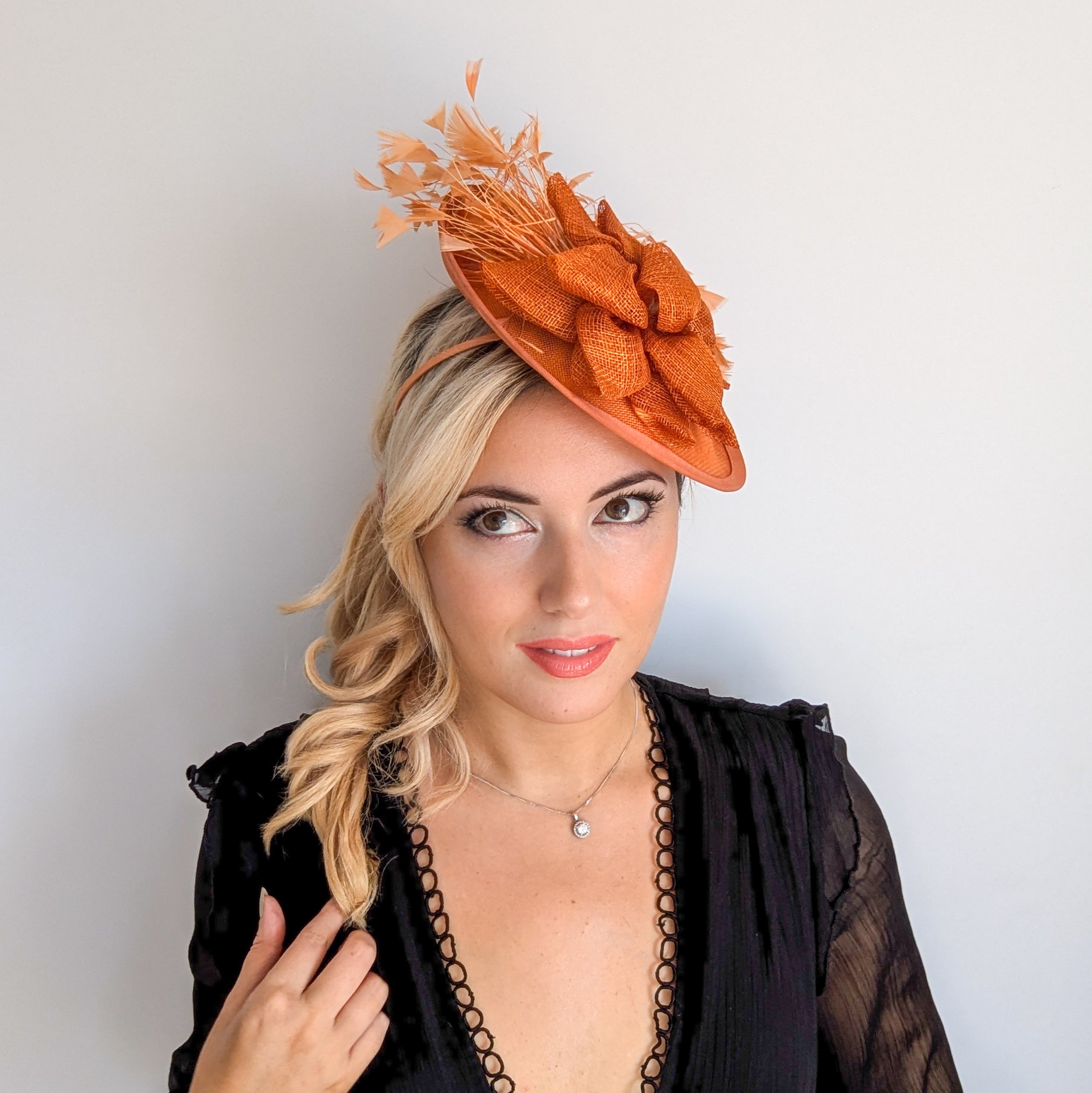 Burnt orange feather disc fascinator hat