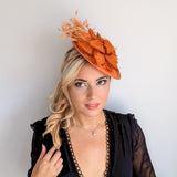 Burnt orange feather disc fascinator hat