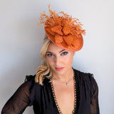 Burnt orange feather disc fascinator hat