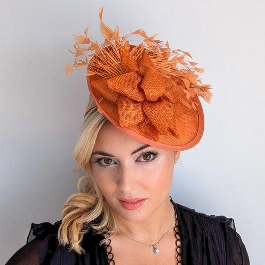 Burnt orange feather disc fascinator hat