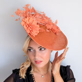 Terracotta dusty coral large flower feather disc fascinator hat