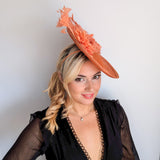 Terracotta dusty coral large flower feather disc fascinator hat