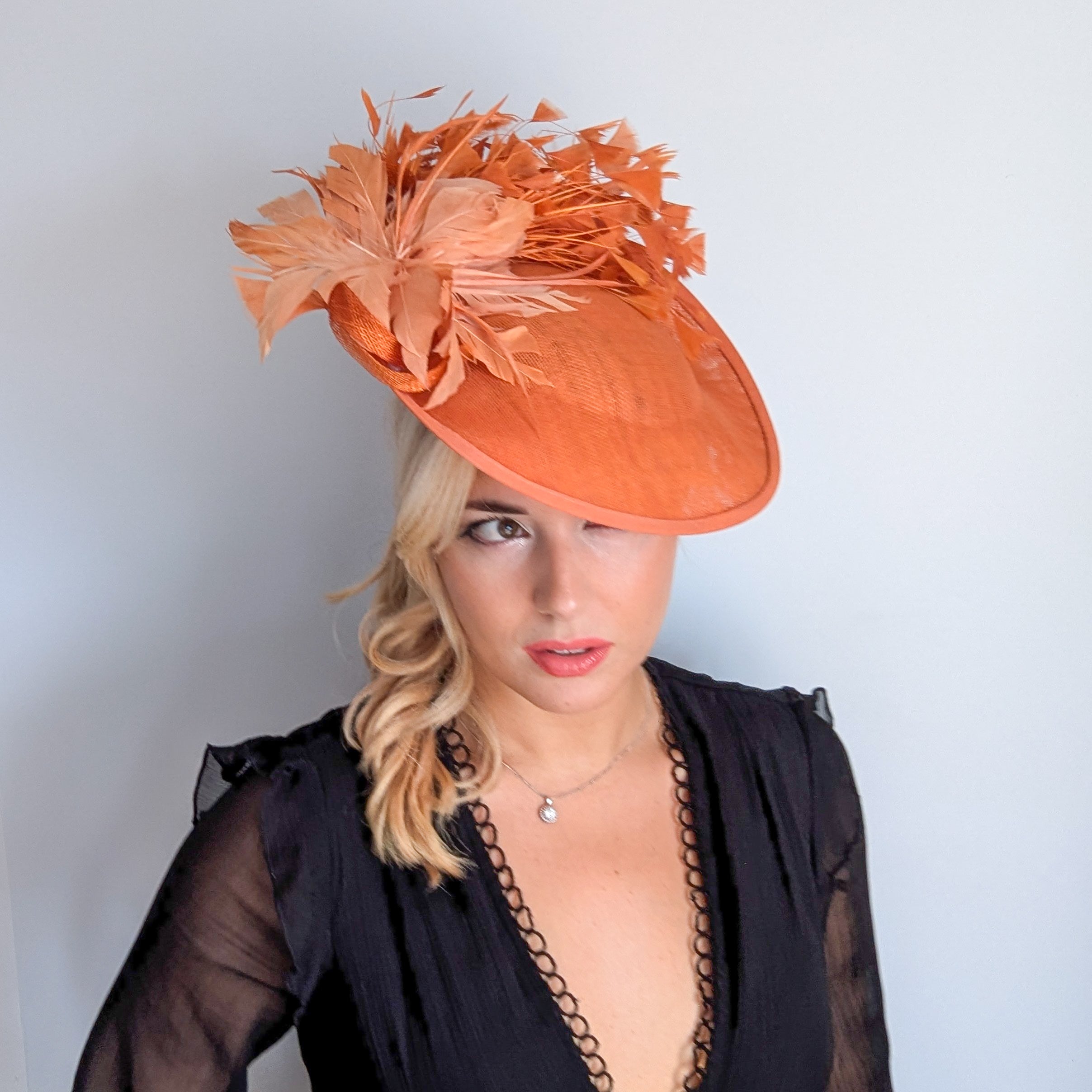Terracotta dusty orange large feather disc fascinator hat