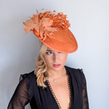Terracotta dusty orange large feather disc fascinator hat