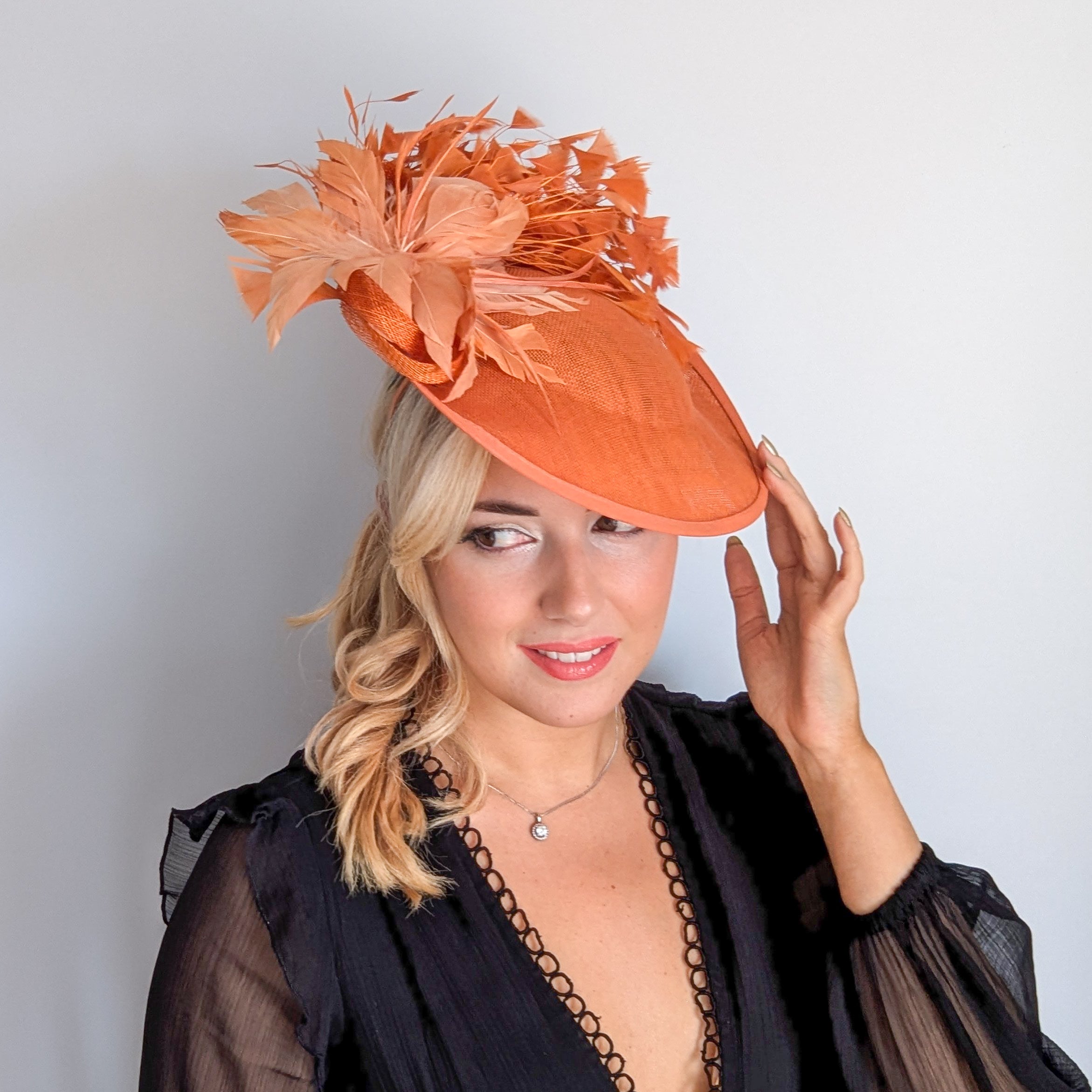 Terracotta dusty orange large feather disc fascinator hat