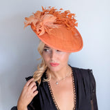 Terracotta dusty orange large feather disc fascinator hat