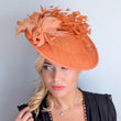 Terracotta dusty orange large feather disc fascinator hat