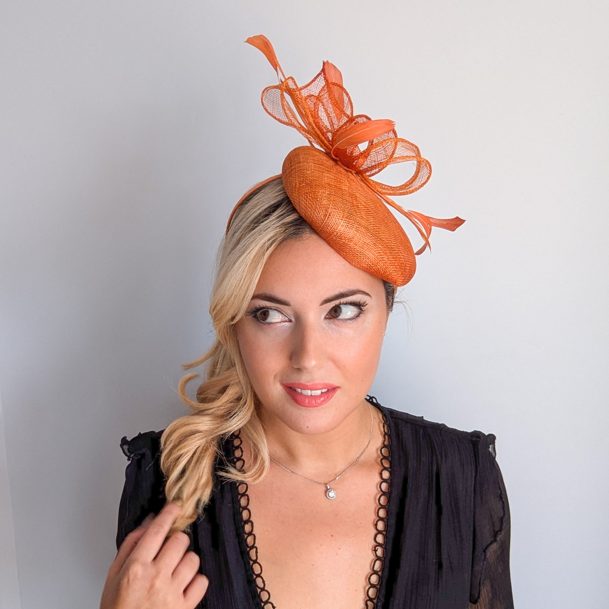 Burnt tangerine orange fascinator hat