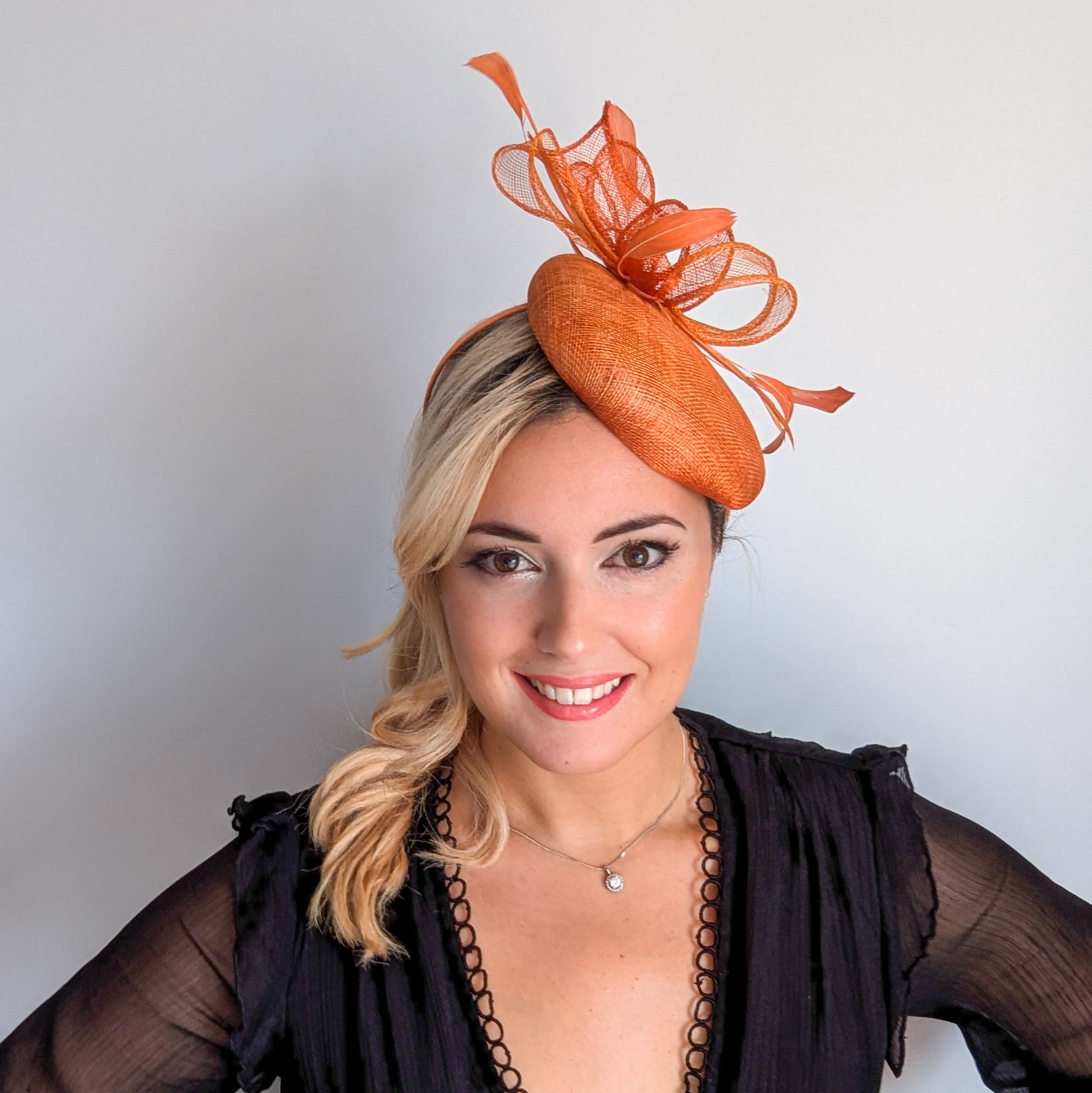 Burnt tangerine orange fascinator hat