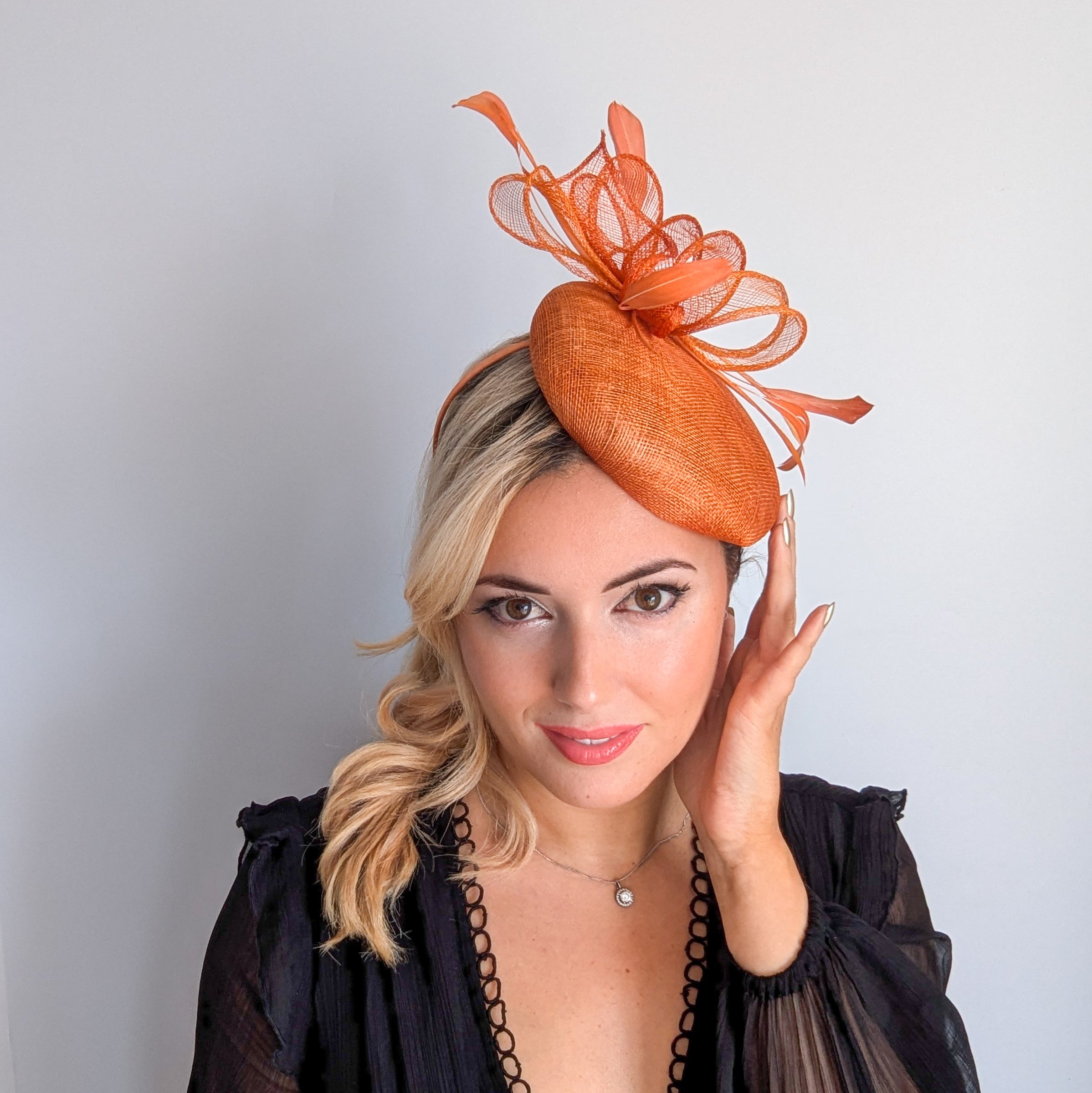 Burnt tangerine orange fascinator hat