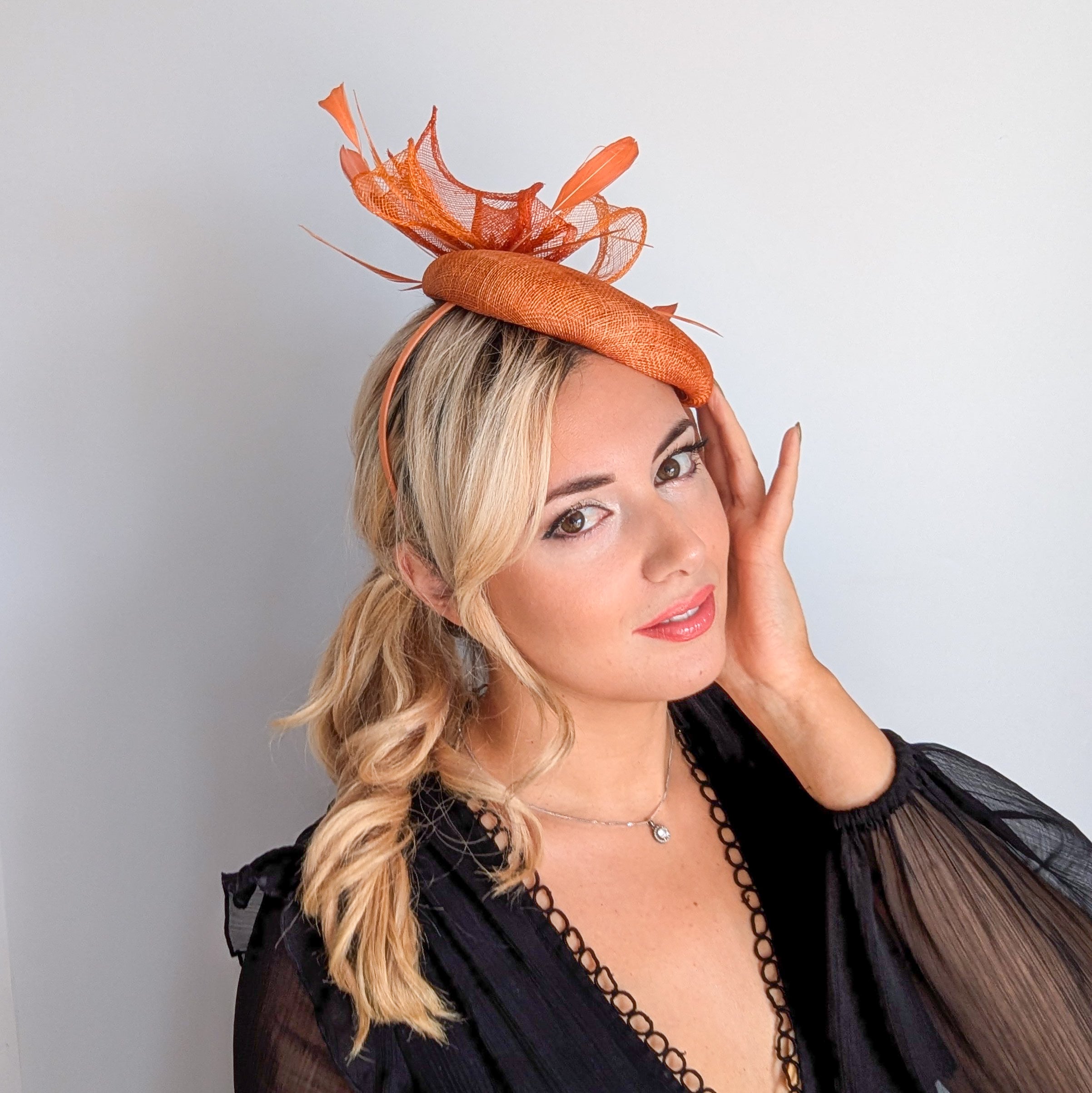 Burnt tangerine orange fascinator hat