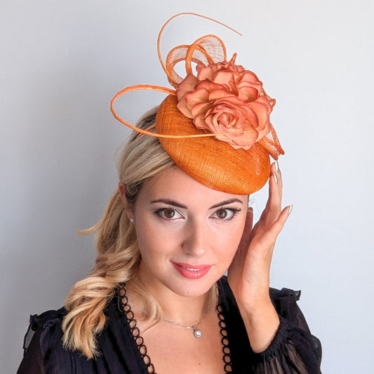 Tangerine orange flower fascinator hat