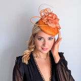 Tangerine orange flower fascinator hat