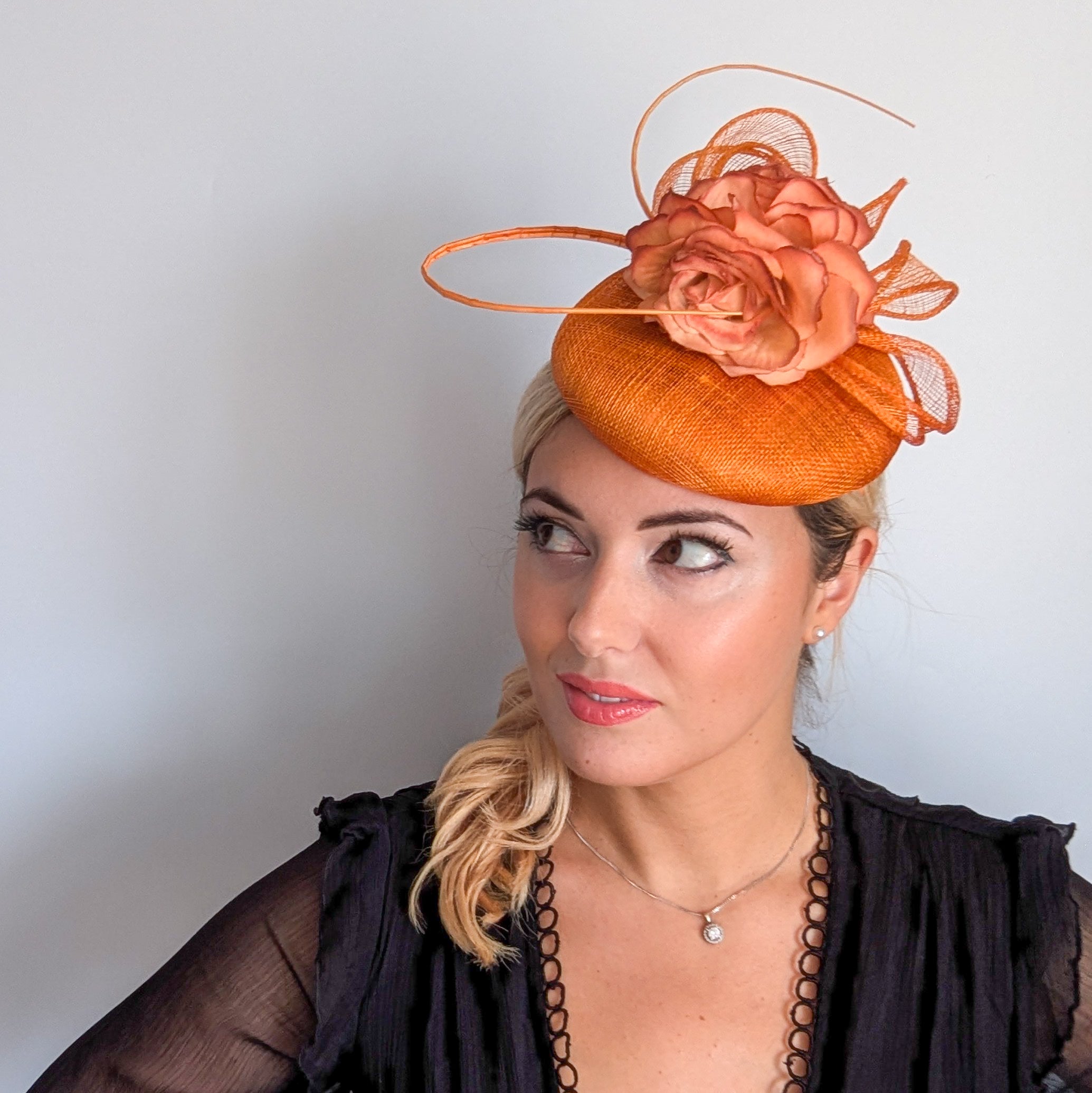 Tangerine orange flower fascinator hat