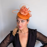 Tangerine orange flower fascinator hat