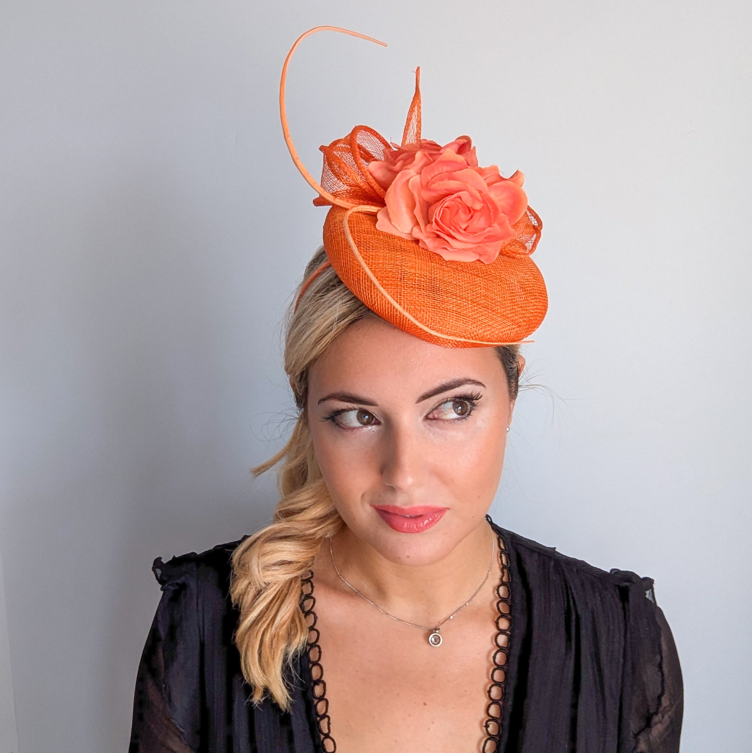 Bright orange coral flower fascinator hat
