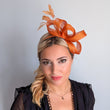 Burnt orange feather fascinator hat