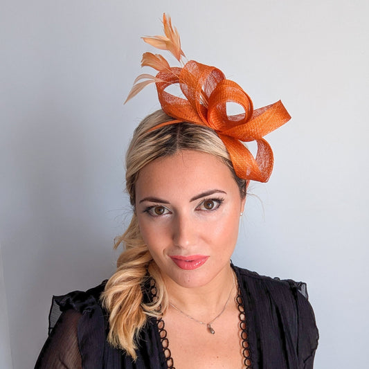 Burnt orange feather fascinator hat