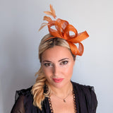 Burnt orange feather fascinator hat